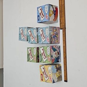 A lot of 7 Burger King Simpson Watches from 2002